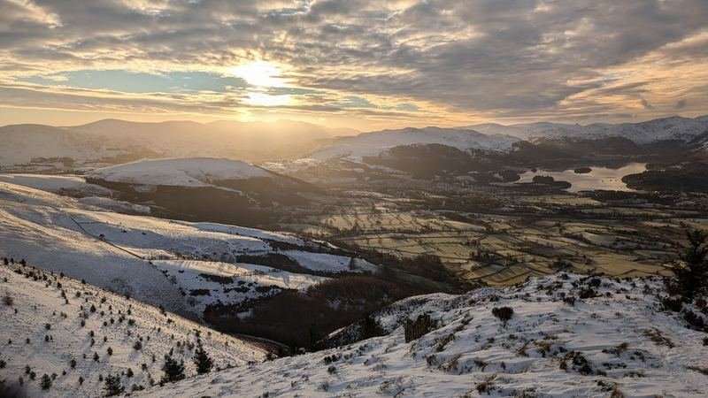 Sunrise over snowy Lake District fells